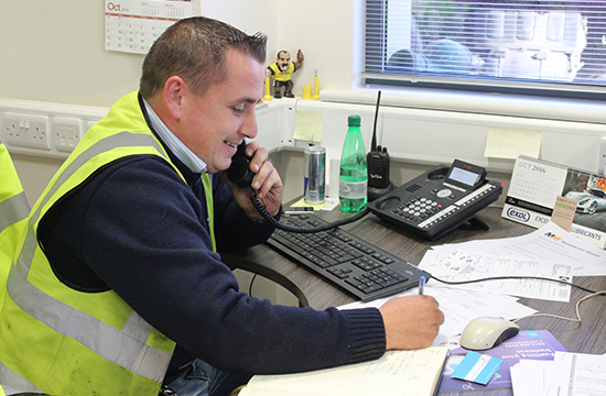 A member of the Morecambe Metals team on the phone consulting about a factory clearance