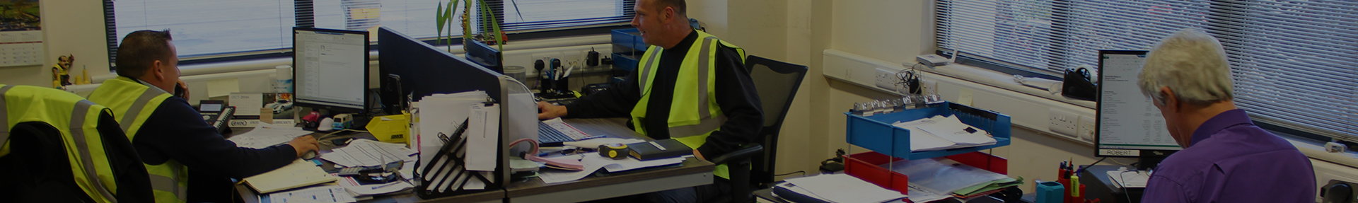 Office workers in a building completing legislation paperwork