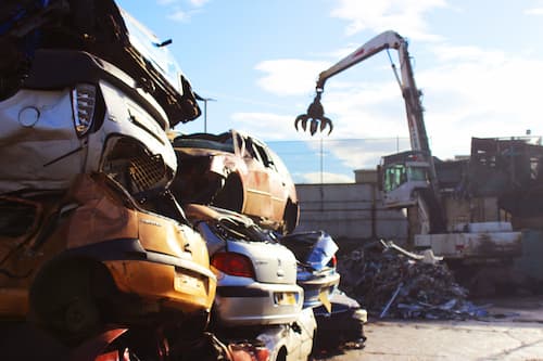 cars piled up to be scrapped