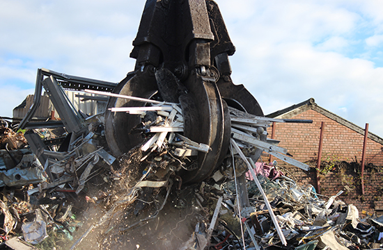 Scrap metal being cleared after a factory clearance