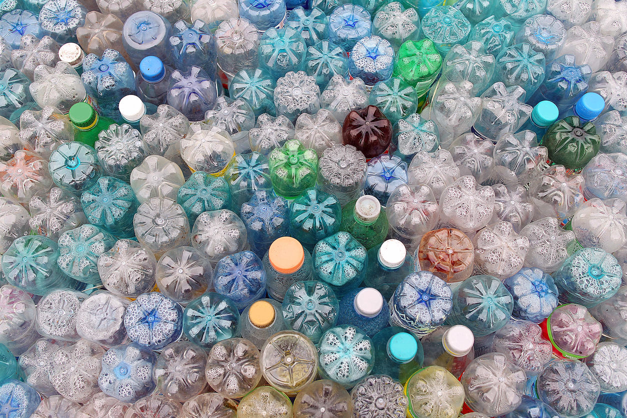 Dirty used colored plastic bottle pile