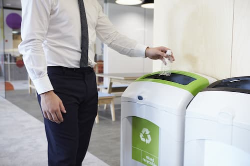worker using recycling bin