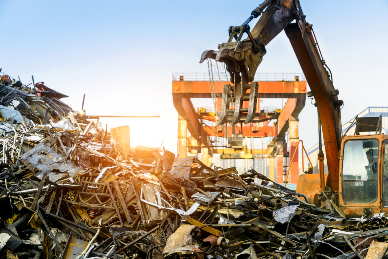Grab crane works in scrap metal recycling station