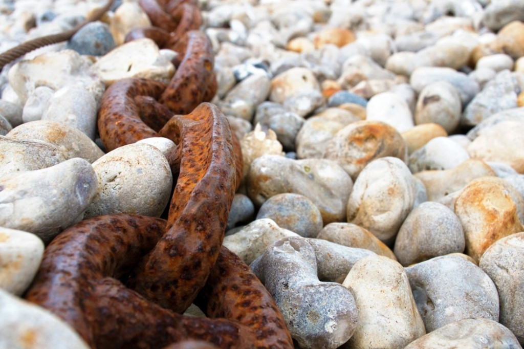 A close-up of a chain on rocks